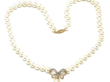 14k Gold Pearl with Diamond Ribbon Necklace For Sale